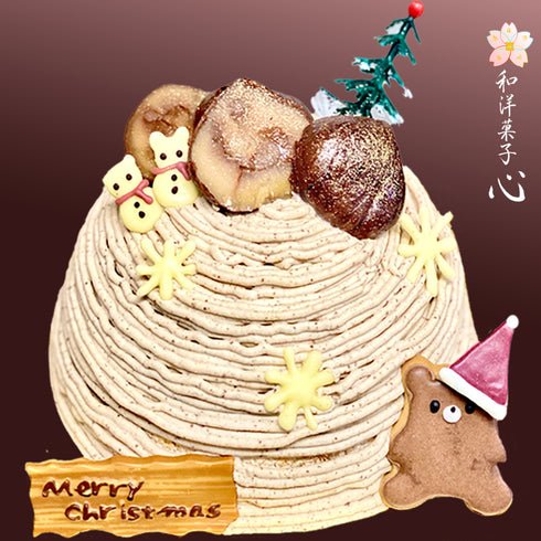 クリスマス仕様の栗の渋皮煮モンブランの写真。たっぷりと絞ったモンブランクリームのケーキの上には大粒の自家製の栗の渋皮煮が2粒も!チョコ細工とくまサンタのアイシングクッキー、プレートを飾って仕上げたクリスマス仕様の和栗のモンブランの写真。